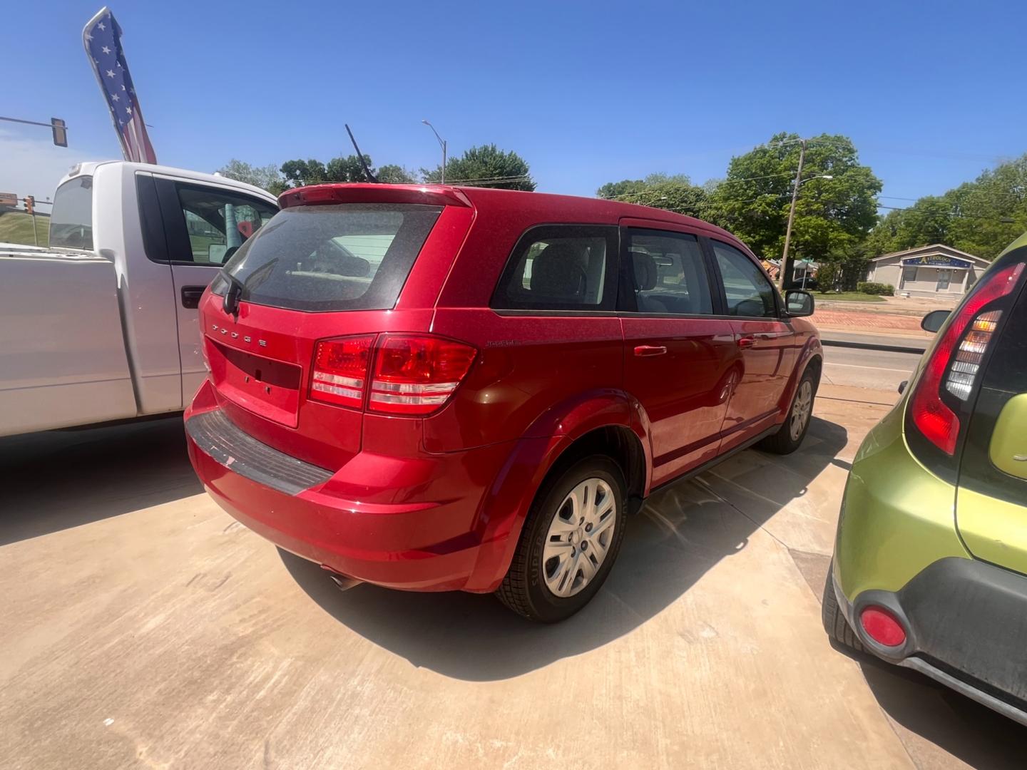 2014 RED DODGE JOURNEY SE SE (3C4PDCAB9ET) with an 2.4L L4 DOHC 16V engine, 4-Speed Automatic transmission, located at 8101 E. Skelly Dr., Tulsa, OK, 74129, (918) 592-3593, 36.121891, -95.888802 - Photo#1